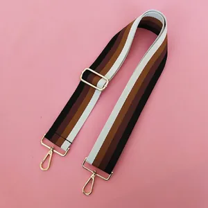 Close-up of adjustable wide cotton shoulder strap with black and brown stripes