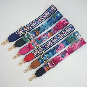 Detail of adjustable wide shoulder straps with bohemian floral patterns and gold metal clips