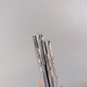 Close-up of clear TPU phone case showing side buttons and precise port cutouts