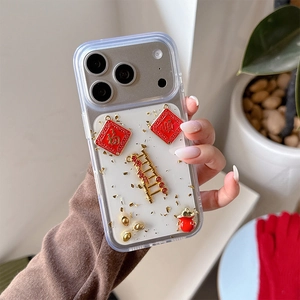 Detail of iPhone case with 3D gold ingots, lucky red bags and festive glitter design