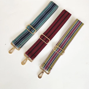Three adjustable woven bag straps with ethnic patterns and polished gold metal hooks