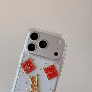 Detail of iPhone case with gold foil, Fu character plaque, and traditional bamboo pendant