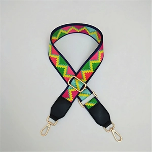 Close-up of colorful pixel wave patterned bag strap with golden metal lobster clasps