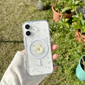 Detailed view of clear MagSafe case with white dried flowers and silver glitter sparkles
