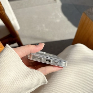 Detail view of precise bottom cutouts for charger and speakers on glitter phone case