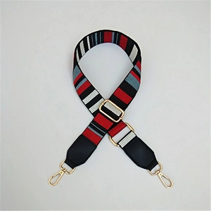 Adjustable wide striped shoulder strap with gold metal buckles and leather reinforcement