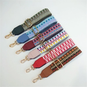 Adjustable woven shoulder straps with ethnic patterns and gold metal buckles