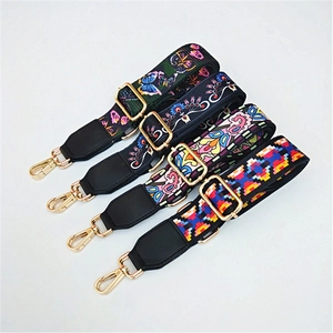 Close-up of bohemian pattern jacquard bag straps with golden hooks and leather ends