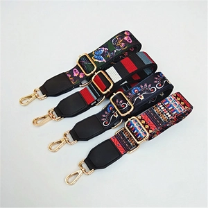 Detailed view of four colorful patterned guitar style straps for crossbody bags