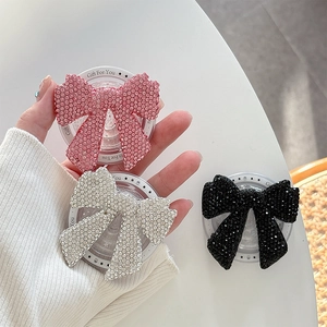 Bowknot phone grip set with rhinestones in pink, silver, and black colors