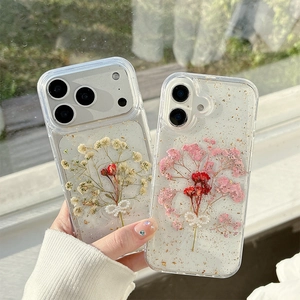 Clear iPhone case with real dried flowers, gold foil, and pearl butterfly accents