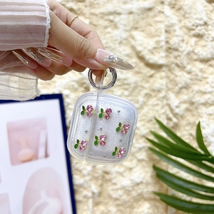 Glitter case for AirPods with pink rhinestone cherries and silver metal carabiner