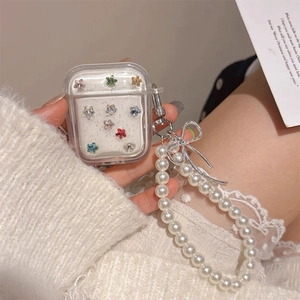 Clear AirPods case with colorful star rhinestones and elegant white pearl lanyard chain