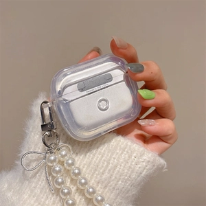 Detail of pearlescent AirPods Pro case with elegant pearl strap and silver bow charm
