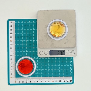 Detailed view of red and yellow rhinestone phone sockets showing 5cm size and 23g weight