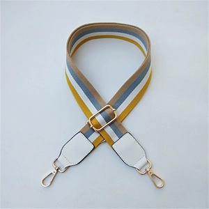 Adjustable woven strap for bags with yellow and white stripes and gold hooks