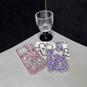 Luxury rhinestone iPhone case with crystal bow and pearls in pink and purple colors