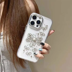 Custodia trasparente per iPhone 16 Pro con fiocco di strass e perla dal design raffinato