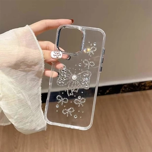 Custodia iPhone 16 Pro trasparente con fiocchi di cristallo, perle e bordo fotocamera argento