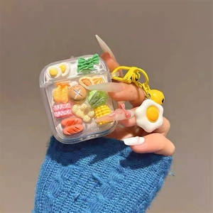 Glittery transparent AirPods case with 3D miniature food models and egg charm
