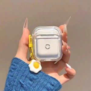 Transparent AirPods case with yellow lanyard and a cute fried egg pendant charm accessory