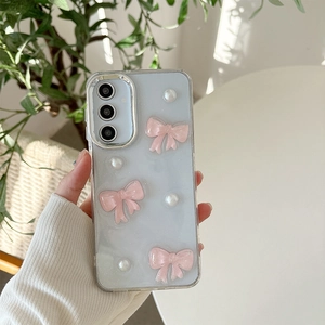 Close-up of glitter phone case with pink bows and pearls for Samsung S25 Ultra