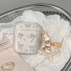 Glittering AirPods case with silver bow and elegant large pearl ribbon pendant