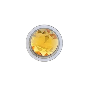 Magnetic rhinestone phone socket with amber crystal center on a clean white background