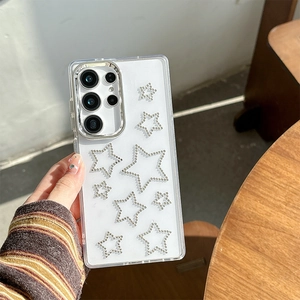 Detail of transparent Samsung Galaxy case with shiny silver rhinestone stars and metal camera trim