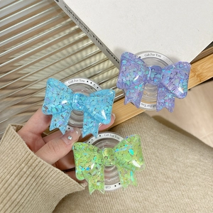 Sparkly glitter bow-knot phone socket holders in purple blue and green pastel colors