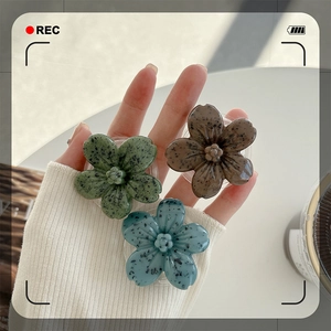 3D flower phone grip sockets in dark green brown and blue with artistic stone texture