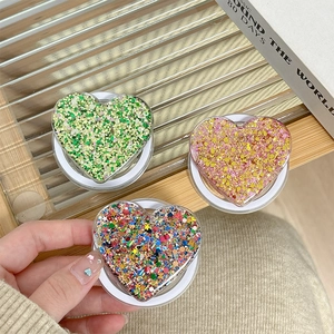 Sparkly heart shaped collapsible phone grip stand with colorful glitter and sequins
