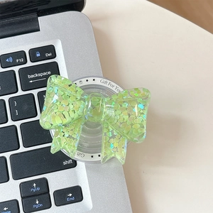 Detail of light green bow phone grip with glitter heart sequins and Gift For You text