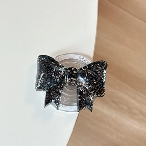 Makro-Detail einer 3D-Schleifen-Handyhalterung mit buntem Glitzer und Magnetbasis