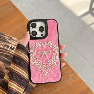 Pink faux leather iPhone case with rhinestone heart and silver bow detail