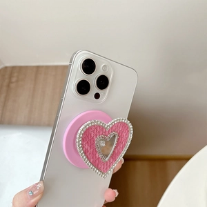 Detail of pink heart phone grip with faux snakeskin leather and sparkling rhinestones