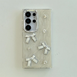 Macro detail of Samsung S24 case with white rhinestones and pearl bowknot design