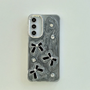 Detail of grey marble Samsung case with 3D black bows and sparkling rhinestones
