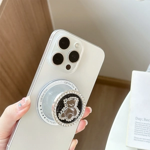 Close-up of rhinestone phone grip with cartoon bear and 'Gift For You' transparent base