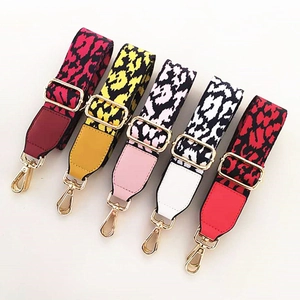 Detail of adjustable leopard print bag straps with gold metal hooks in five colors