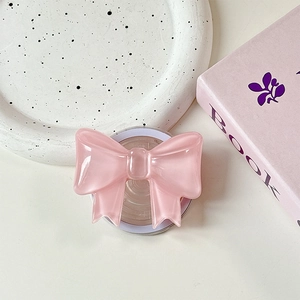 Detail of soft pink bow phone grip with iridescent pearlescent resin finish