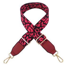 Adjustable leopard print wide strap with red leather ends and gold metal hooks
