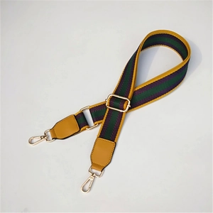 Adjustable woven replacement purse strap with purple and green ethnic stripe pattern