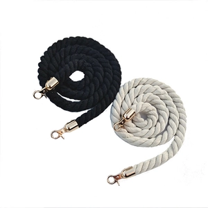 Narrow woven rope shoulder strap with gold lobster clasps in black and cream white