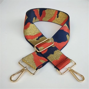 Close-up of 5cm wide adjustable camouflage star strap with gold metal lobster clasps