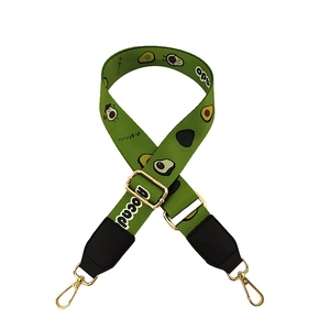 Adjustable canvas shoulder strap featuring cute green avocado prints and gold metal hooks