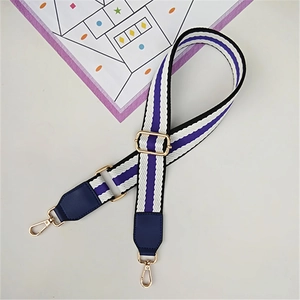 Close-up of striped purple and white bag strap with gold metal hooks and blue leather