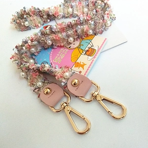 Pink woven purse strap with pearls and gold metal lobster clasps for shoulder bags