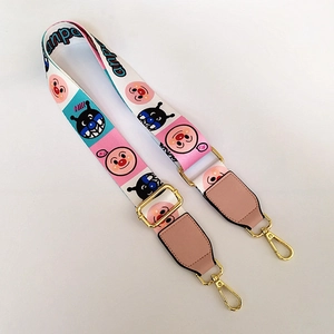 Adjustable wide strap for bags featuring cartoon character patterns with gold metal hooks
