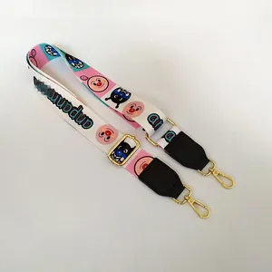 Detail of adjustable wide woven bag strap with Anpanman print and gold lobster claws